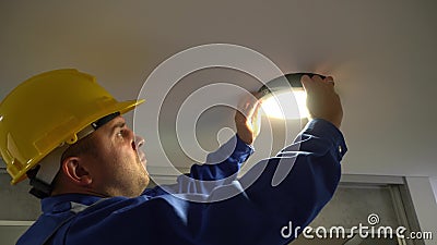 Electrician Man Remove Led Panel Light From Ceiling And Inspect Wire Connections