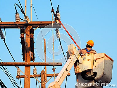 Electrician man working at height and dangerous Editorial Stock Photo