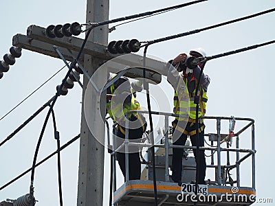 Electrician man working at height and dangerous Editorial Stock Photo