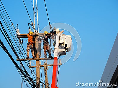 Electrician man working at height and dangerous ,high voltage power line Editorial Stock Photo