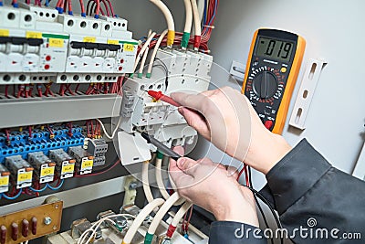 Electrician measurements with multimeter tester Stock Photo