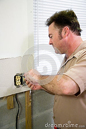 Electrician with Receptacle Stock Photo