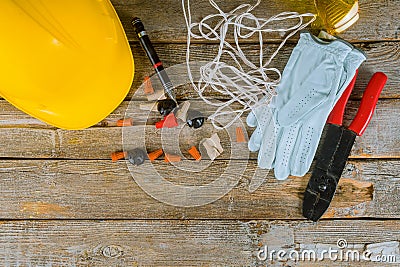 Electrician technician at work prepares the tools and cables used in electrical installation and yellow helmet Stock Photo