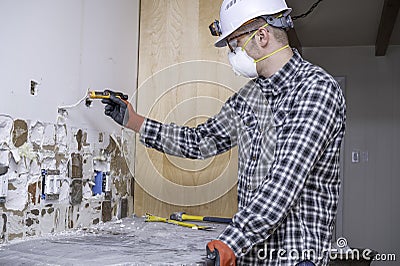 Electrician testing home wiring Stock Photo