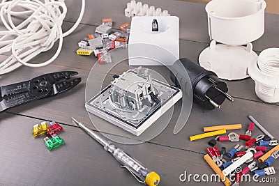 Electrician tools and accessories on wooden table Stock Photo