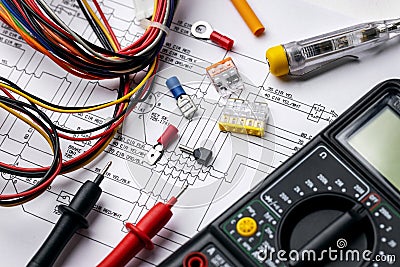 Electrician tools and electrical equipment on wiring diagram Stock Photo