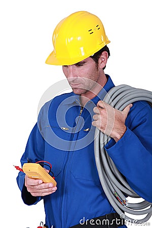 Electrician with voltmeter Stock Photo