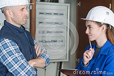 Electrician workers with switching on electric power Stock Photo