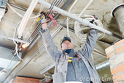 Electrician working with cabling Stock Photo