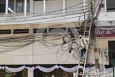 Electrician working in cambodia Editorial Stock Photo