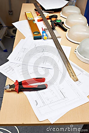 Electrician working place with drawings and tools Stock Photo