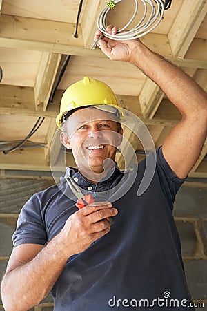 Electrician Working On Wiring Stock Photo