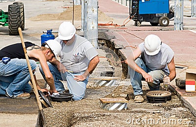 Electricians Installing Lights Stock Photo