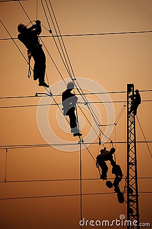 Electricians repair contact wire Stock Photo