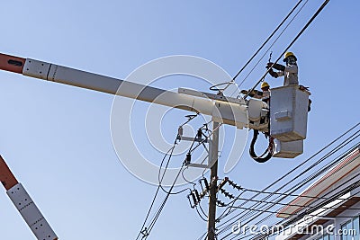 Electricians working on high voltage Editorial Stock Photo