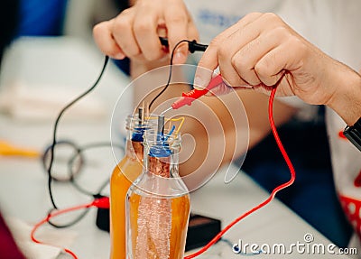 Electricity experiments with bottles and water Stock Photo