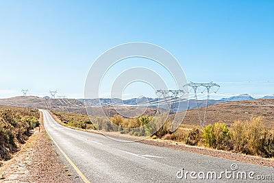 Electricity infrastructure and the road between Ceres and Touws Stock Photo