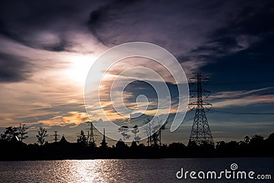 Electricity Pillars against clouds storm Stock Photo