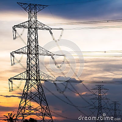 Electricity Pillars against colorful sunset Stock Photo