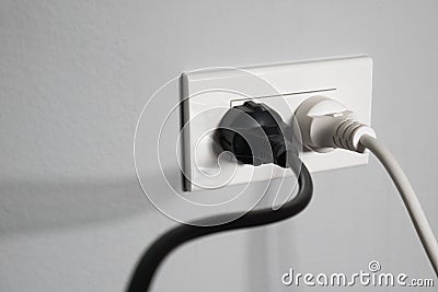 Electricity plugs in the socket Stock Photo