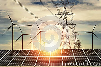 electricity power in nature. clean energy concept. solar panel with turbine and tower hight voltage sunset background Stock Photo