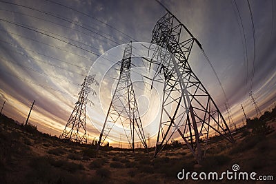 Electricity power pylons at sunset Stock Photo