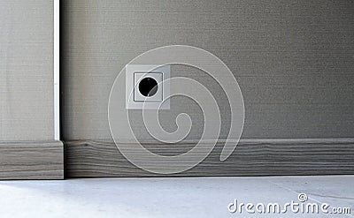 Electricity power socket on wall background Stock Photo