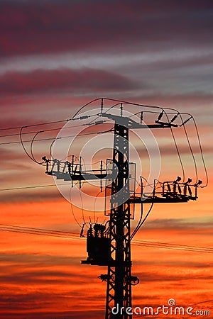 Electricity pylon at sunset Stock Photo