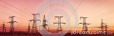 Electricity pylons and lines at dusk. Stock Photo