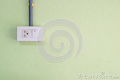 Electricity Switches and Socket on cement wall background Stock Photo