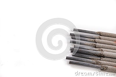 Electrodes for electric welding on a white workbench. Welding accessories for MMA methods Stock Photo