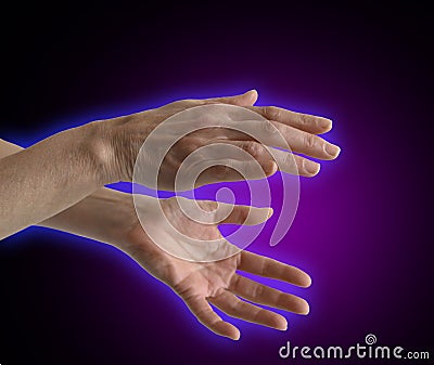 Electromagnetic Aura around healer's hands Stock Photo