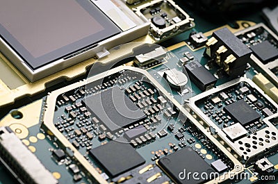 Electronic Board with processors, resistors and semiconductor components close-up Stock Photo