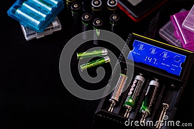 Electronic Chargers with display for rechargeable batteries with Stock Photo