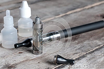 Electronic cigarette on old wooden table Stock Photo