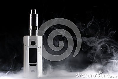 Electronic cigarette over a dark background. Stock Photo