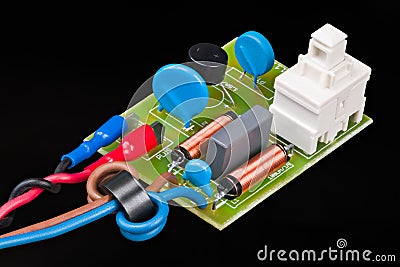 Electronic components of electric motor supply module on black background Stock Photo