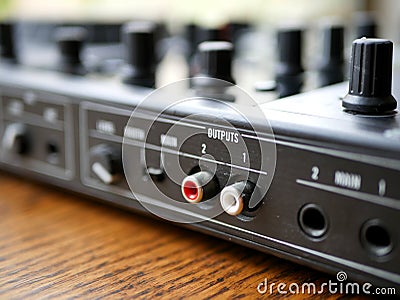 Electronic dance music digital audio dj gear with knobs, faders, at an edm festival. Stock Photo