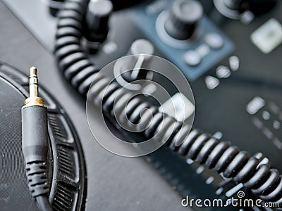 Electronic dance music digital audio dj gear with knobs and headphone cable at an edm festival. Stock Photo