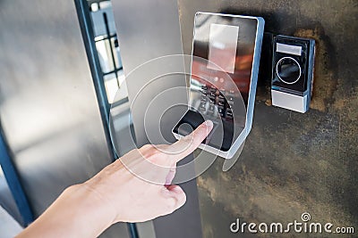 Electronic digital door in Officer scan finger print for enter security system Stock Photo