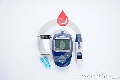 Electronic glucometer, lancet and test strip for determining blood sugar levels isolated on a white background. Diabetes Stock Photo