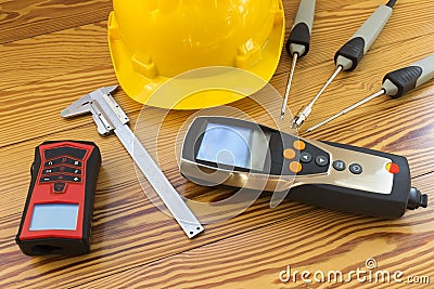 Electronic instrument for measuring of temperature probes on wood background Stock Photo