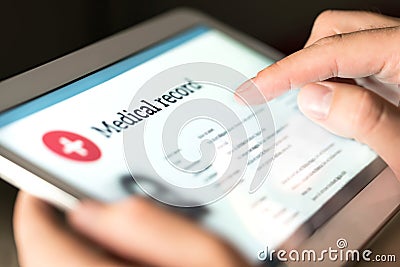 Electronic medical record with patient data and health care information in tablet. Stock Photo