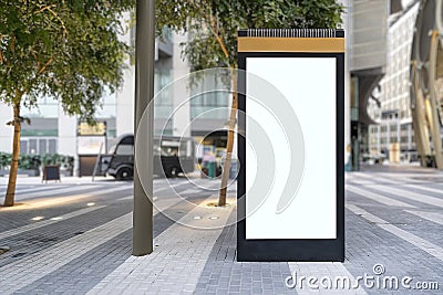 Electronic modern empty scoreboard on the background of a city street. Blank mock up of vertical street poster billboard on city Stock Photo