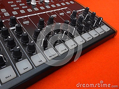 Electronic musical instrument or audio mixer or sound equalizer on a orange background analog modular synthesizer Stock Photo