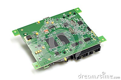 Electronic printed circuit board with chips and other components, green color, back side, angled view, isolated on white Stock Photo