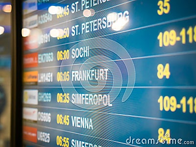 Electronic scoreboard flights and airlines. Destinations: Simferopol, Bahrain, Minsk, St.Petersburg, Sochi, Frankfurt Editorial Stock Photo