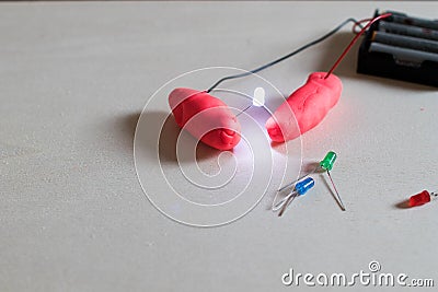 Electronic soft circuits with LEDs, batteries and modeling clay. Stock Photo