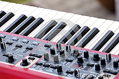 Electronic synthesizer. midi controller volume fader, knobs and Stock Photo