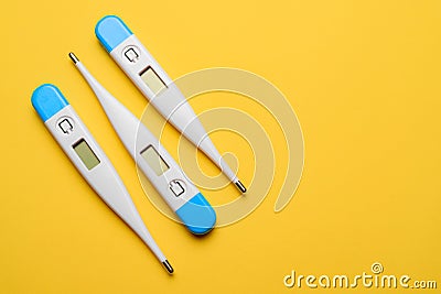 Electronic thermometers . Electronic thermometer on a yellow background. Temperature measurement. Safe thermometer. Modern medical Stock Photo